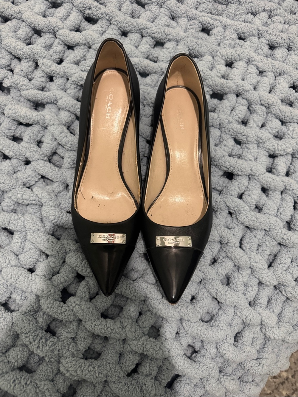 Coach Black Pointed Toe Leather Pumps with Silver Logo Plate